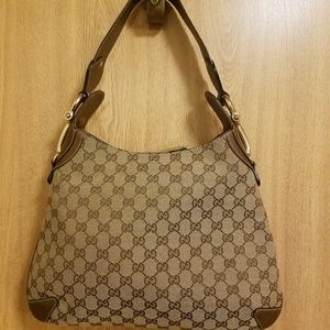 Gucci monogram with horsebit detail